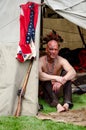 native american man in teepee