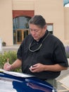 Native American man writing notes Royalty Free Stock Photo