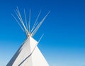 Native American tipi under blue sky Royalty Free Stock Photo