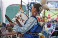 Native American woman dances with Papoose Cradleboard