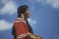 Native American woman on horseback