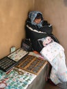 Native American woman selling turquoise jewellery