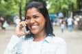 Native american woman speaking at phone in a park Royalty Free Stock Photo