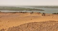 Native archaeological excavation assistants during excavations in the desert on the banks of the Nile River