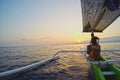 Native bali men wooden boat sunrise ocean