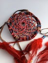 Native handmade dreamcatcher made from a willow branch in Canada on a white background