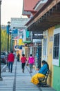 Native Indigenous old lady in traditional dress in colorful city street, in Creel, Mexico, America Royalty Free Stock Photo