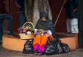 Native Indigenous old lady in colorful dress with handmade business, in Mexico, America