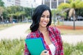 Native latin american female student looking at camera