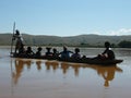 Native Malagasy people crossing river Royalty Free Stock Photo