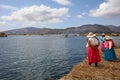 Native People at Uros Floating Islands in Lake Titicaca. Peru