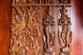 Native Thai style carving, painting on church door in the temple Royalty Free Stock Photo