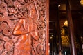 Native Thai style carving, painting on church door in the temple Royalty Free Stock Photo