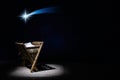 Nativity of Jesus, empty manger at night with bright lights. Royalty Free Stock Photo