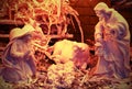 Nativity scene with beautiful wooden statues and the manger Royalty Free Stock Photo