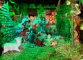 Nativity scene. Christmas Manger scene with figurines newborn Jesus, Mary, Joseph, sheep and donkey Royalty Free Stock Photo