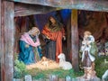 Nativity Scene with Figures - Baby Jesus, Mary, Joseph and a Shepherd with Sheep Royalty Free Stock Photo