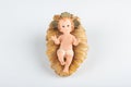 Nativity scene figurine of baby jesus with white background Royalty Free Stock Photo