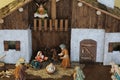 Nativity scene with the holy family and an angel with the Glory