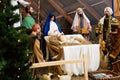 Nativity scene with Holy Family: baby Jesus, Blessed Virgin Mary, Saint Joseph, angel and three wise men and sheep. Nativity. Royalty Free Stock Photo