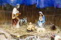 Nativity scene, holy family figurines on hay. Birth of savior Jesus Christ, Christmas essence Royalty Free Stock Photo