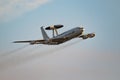 NATO Boeing E-3 Sentry AWACS radar plane performing a low-pass at the Sanice Sunset Airshow. Belgium - September 13, 2019 Royalty Free Stock Photo