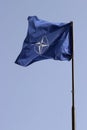 NATO flag on a pole Royalty Free Stock Photo