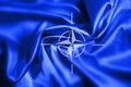 NATO flag silk fabric  wallpaper  background wave alliance security Royalty Free Stock Photo