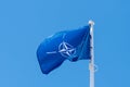 NATO flag in the clear sky background