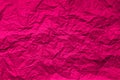 Natural abstract textured background of wrinkled pink paper