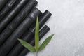 Natural activated bamboo charcoal on concrete background. Realistic pieces charcoal