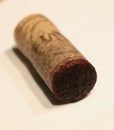 a natural wine cork with little cork bleed of red wine