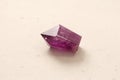 Natural amethyst stone on light background. Natural stones, crystals for magic, lithotherapy, geology, minerals, stone collection