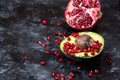 Natural antioxidants - natural antioxidants, avocado fruit sprinkled with pomegranate seeds, next to a pomegranate