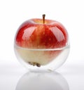 Natural apple inside a glass ball in the shape of an apple