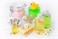Natural baby care products with chamomile oil, flowers extract, soap, salt, cream and shampoo