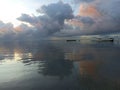 Natural background of dramatic sky clouds over sea horizon with reflections on the water. Beach landscape backgrounds with blue Royalty Free Stock Photo