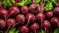 Natural background of fresh young beetroot with green leaves. A delicious quality vegetarian product. Healthy organic eating