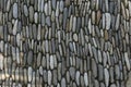 Natural background made of vertical rows of flat gray stones stacked close to each other. Royalty Free Stock Photo