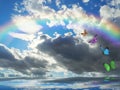 Natural background with rainbow in sea reflection Royalty Free Stock Photo