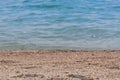 sandy beach and blurred turquoise sea in sunny sparks. Alboran, Benalmadena, Andalusia, Spain A natural background Royalty Free Stock Photo