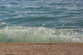 sandy beach and blurred turquoise sea in sunny sparks. Alboran, Benalmadena, Andalusia, Spain A natural background Royalty Free Stock Photo