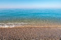 natural background shot of a pebbly beach with no people, no one. Scenic view of empty pebble sea coast on a sunny day Royalty Free Stock Photo