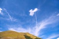 Natural background. Spindrift clouds on a blue sky.