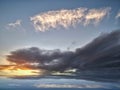 Natural background with sunset and stormy clouds in sea reflection Royalty Free Stock Photo