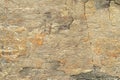 Natural background. Texture of beige sandstone with corrosion pattern