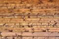 Natural background - a wall of wooden boards with moraine surface. Brown shad Royalty Free Stock Photo