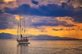 Natural background with Yacht in the Mediterranean sea at sunrise, Cagliari, Italy. he sun illuminates the island with beautiful