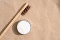 Natural bamboo toothbrush with mineral toothpowder kaolin or baking soda powder cleanser over kraft paper background Royalty Free Stock Photo