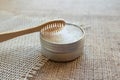 Natural bamboo toothbrushes and kaolin dentifrice or tooth powder made from natural ingredients on rustic background with copy